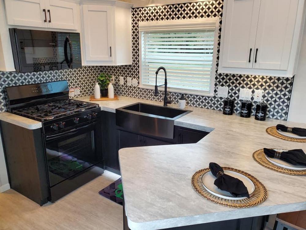 BLACK & WHITE - Black base cabinets and white upper cabinets with white crown molding